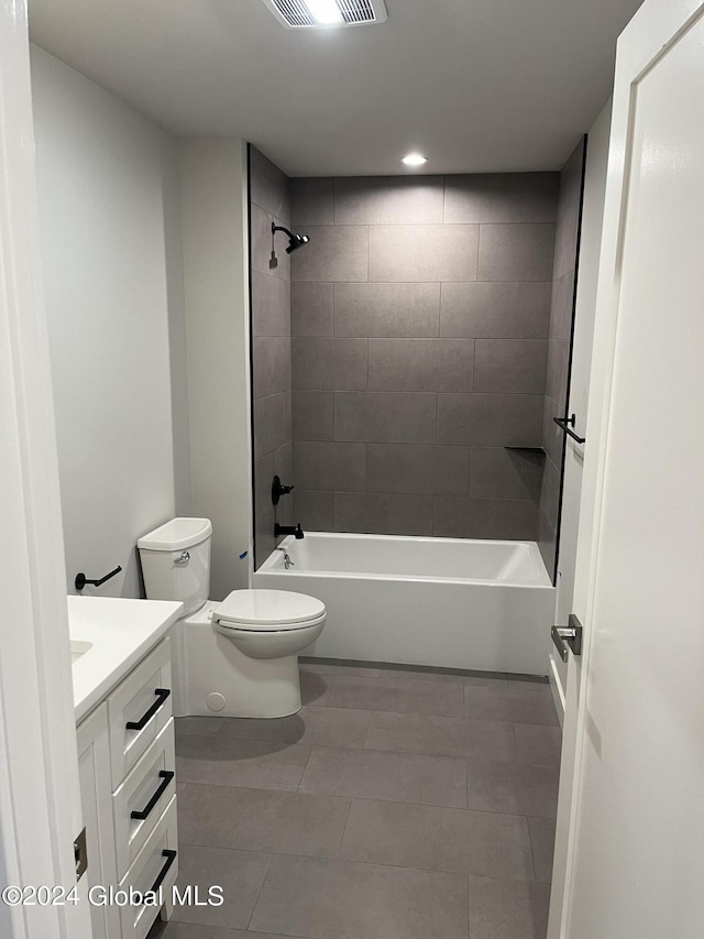 full bathroom with visible vents, shower / bathing tub combination, toilet, vanity, and tile patterned flooring