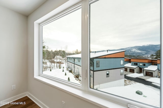 details featuring baseboards and a mountain view