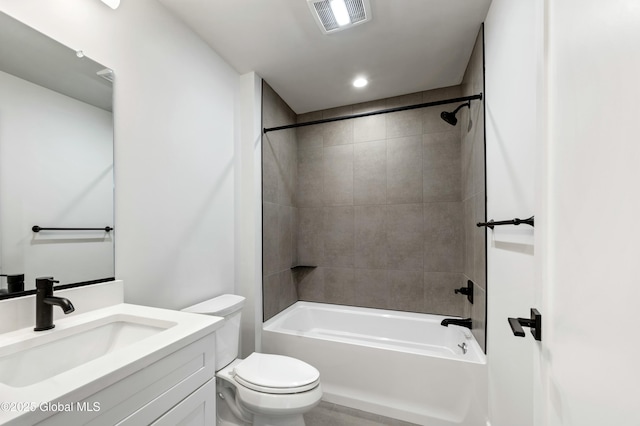 bathroom with toilet, bathtub / shower combination, visible vents, and vanity