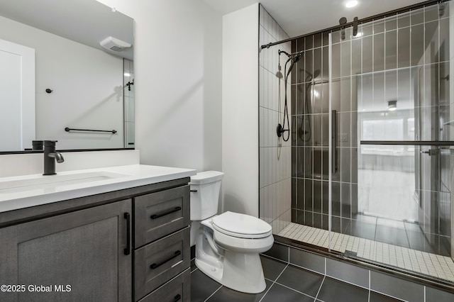 bathroom with visible vents, toilet, tile patterned floors, vanity, and a shower stall