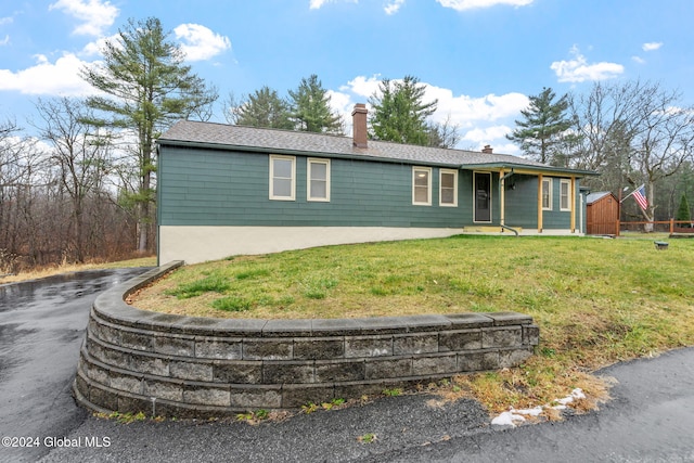 ranch-style house featuring a front lawn