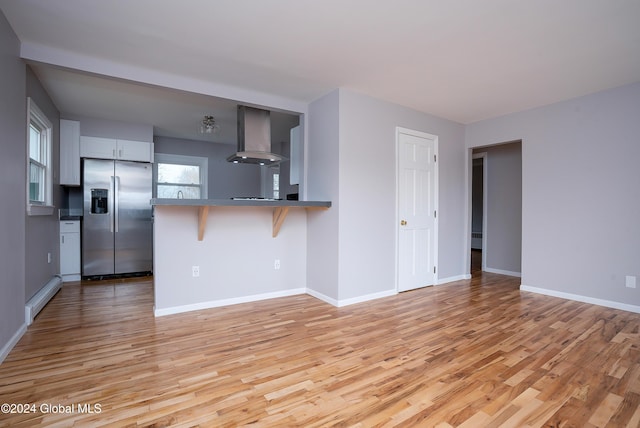 unfurnished living room with light wood-type flooring