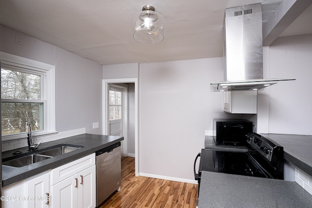 kitchen featuring white cabinetry, sink, island exhaust hood, light hardwood / wood-style floors, and black appliances