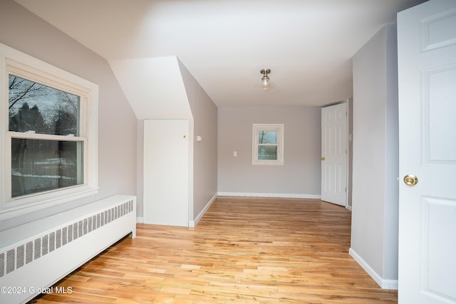 hall featuring radiator and light wood-type flooring