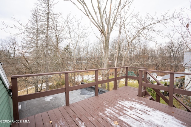 wooden terrace featuring a water view