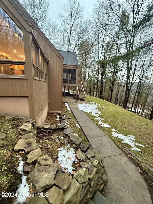 view of yard featuring a sunroom