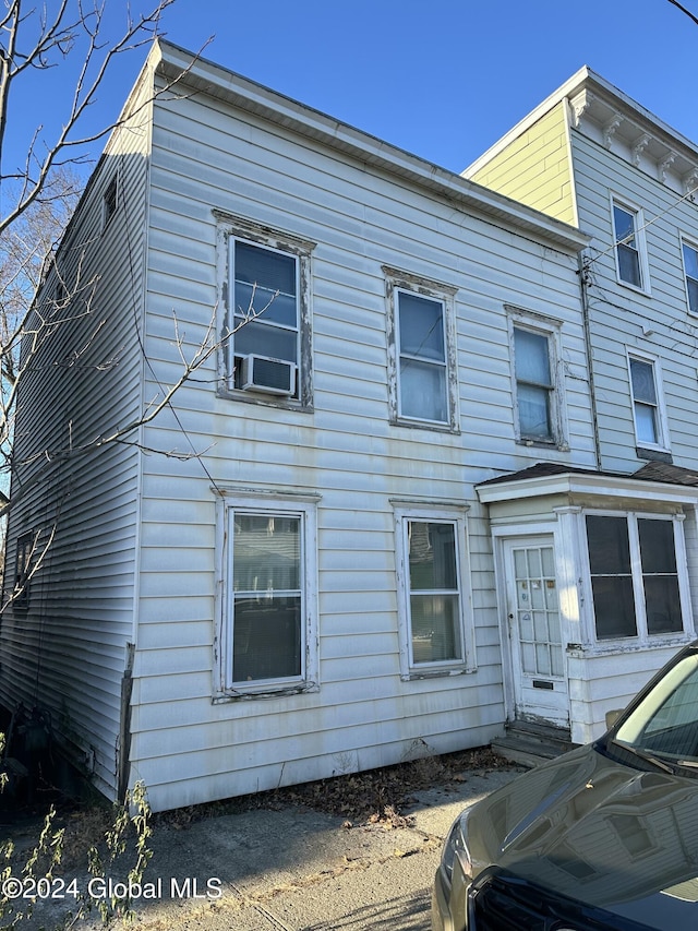 view of front of property with cooling unit