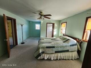 bedroom with ceiling fan and carpet floors