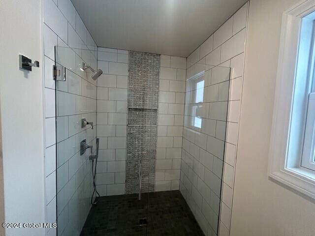 bathroom featuring plenty of natural light and an enclosed shower