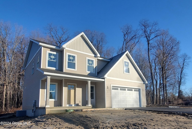 view of front of house with a garage and covered porch