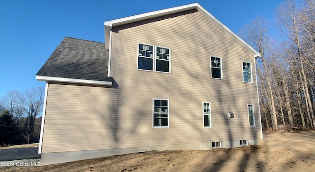 view of side of property featuring central AC unit