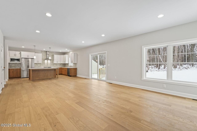 unfurnished living room featuring light hardwood / wood-style flooring