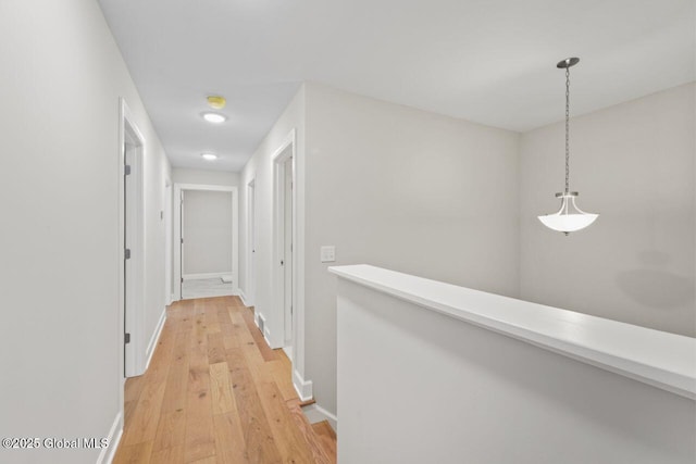 corridor featuring light wood-type flooring