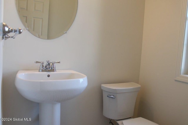 bathroom with sink and toilet