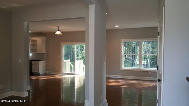 interior space with dark hardwood / wood-style flooring