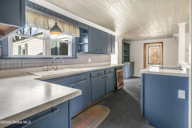 kitchen with dark carpet, blue cabinets, sink, decorative light fixtures, and wooden ceiling