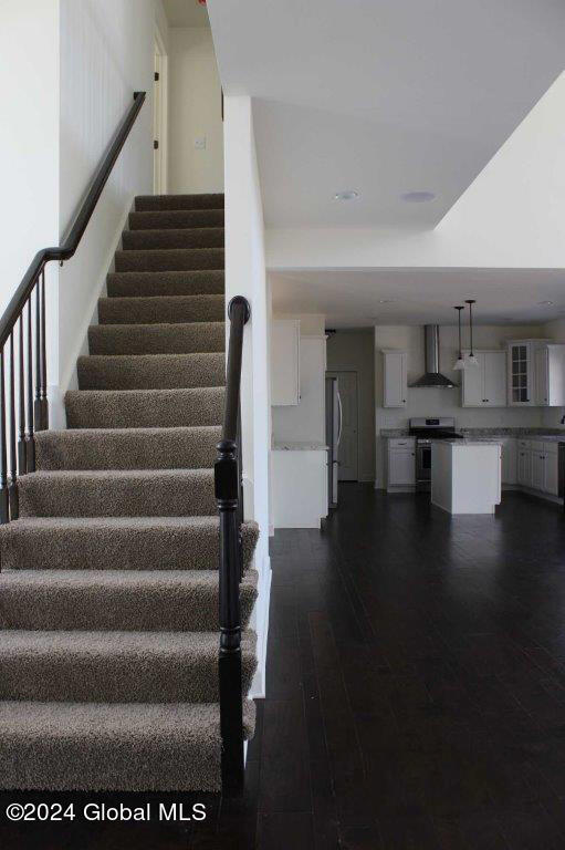 stairs with wood-type flooring