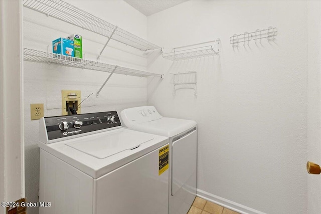 laundry room with independent washer and dryer