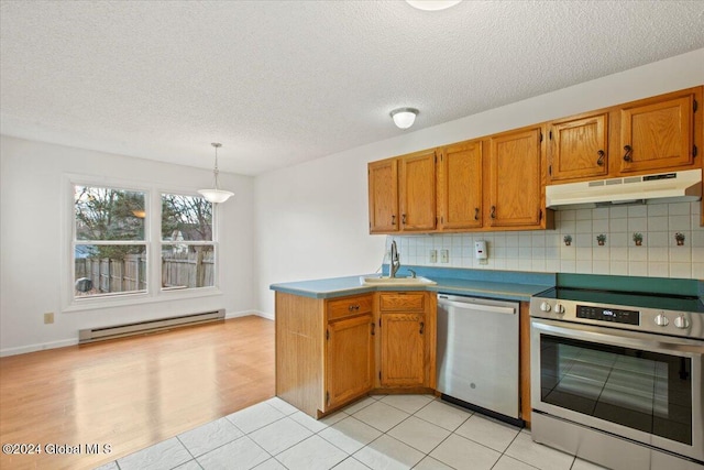 kitchen featuring pendant lighting, a baseboard heating unit, sink, light wood-type flooring, and stainless steel appliances