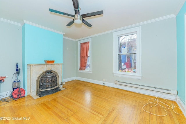 unfurnished living room with hardwood / wood-style floors, baseboard heating, crown molding, and ceiling fan