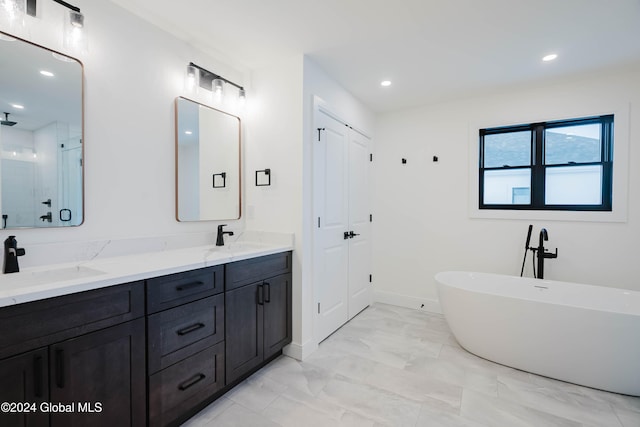 bathroom featuring vanity and shower with separate bathtub