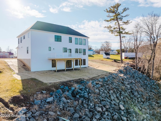 back of property featuring a patio area