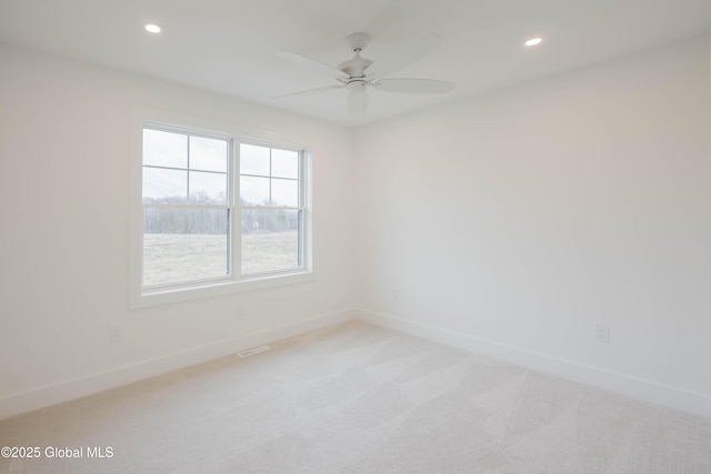carpeted spare room with baseboards, recessed lighting, and ceiling fan