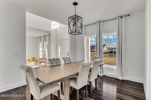 dining room with dark hardwood / wood-style floors