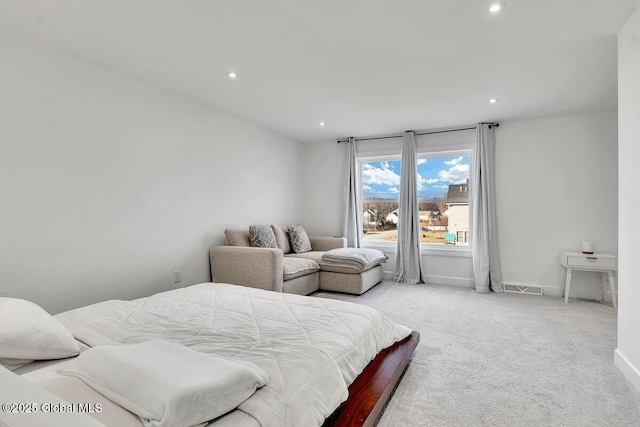 bedroom with light carpet