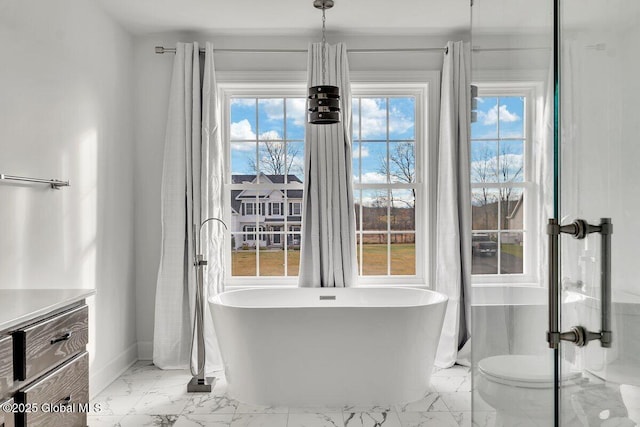 bathroom with a tub to relax in