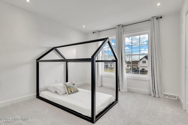 unfurnished bedroom with light colored carpet