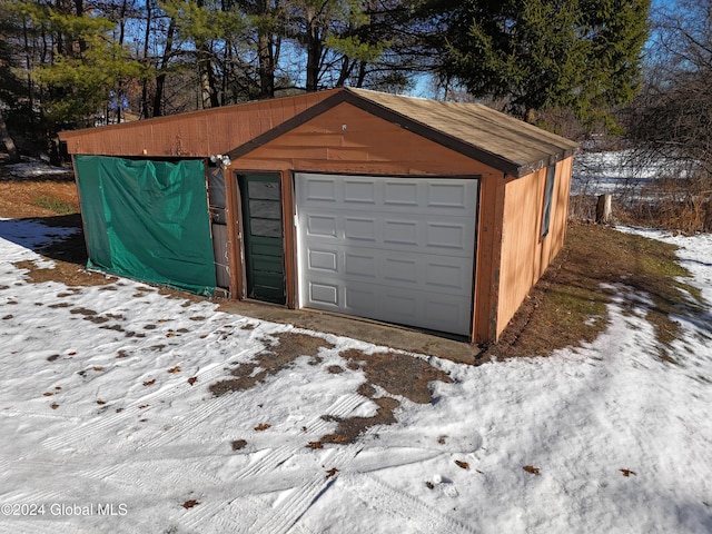 view of snow covered garage