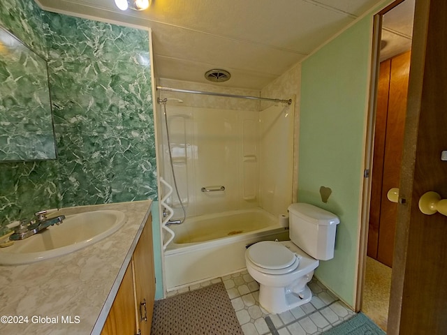 full bathroom featuring vanity, tiled shower / bath combo, and toilet