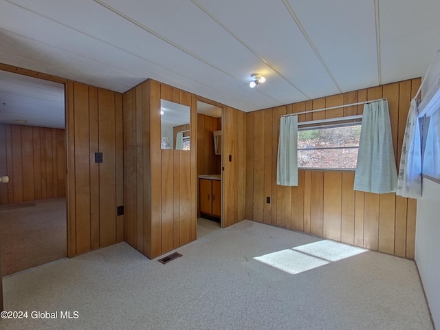 interior space featuring wood walls