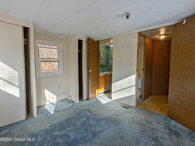 empty room with light colored carpet