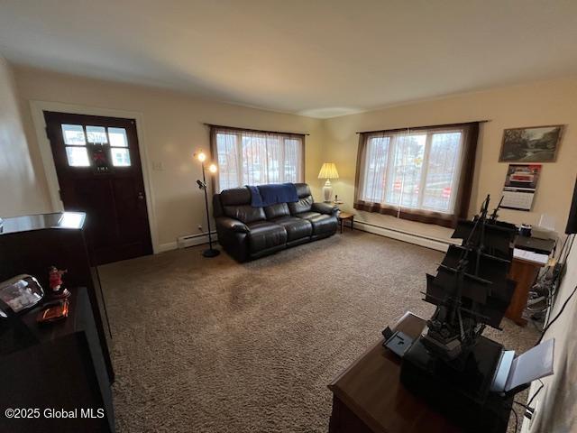 carpeted living room featuring a baseboard heating unit