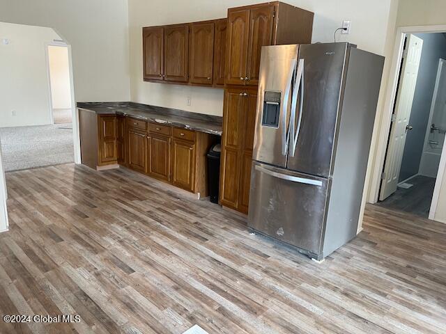 kitchen featuring stainless steel fridge and light wood-type flooring