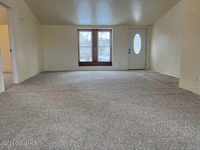 view of carpeted foyer