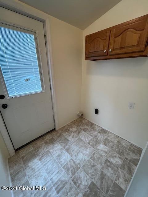 laundry room featuring cabinets