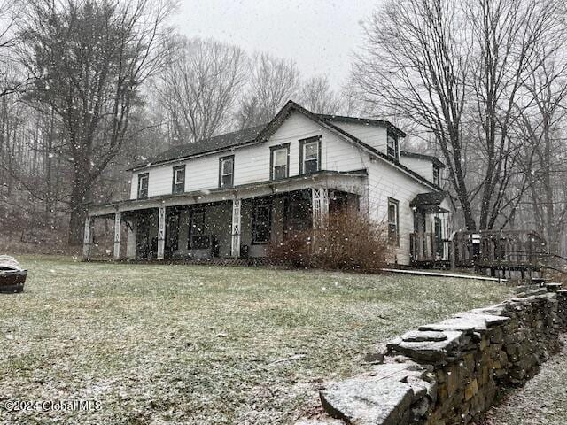 view of side of property with a lawn