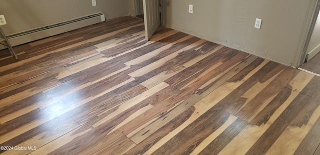 room details with hardwood / wood-style floors and baseboard heating