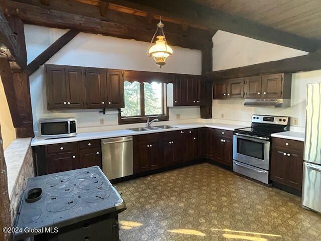 kitchen with sink, vaulted ceiling with beams, decorative light fixtures, dark brown cabinetry, and stainless steel appliances