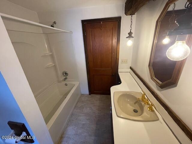 bathroom with vanity and shower / bathtub combination