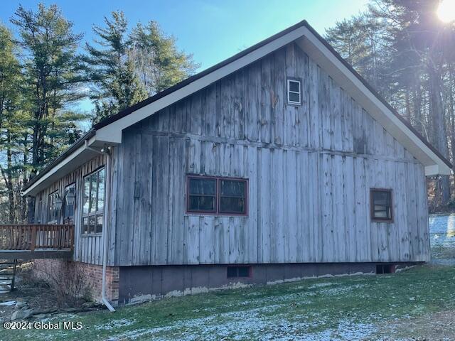 view of home's exterior with a yard