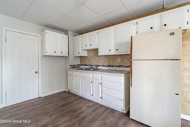 kitchen featuring white cabinets, white refrigerator, and dark hardwood / wood-style flooring