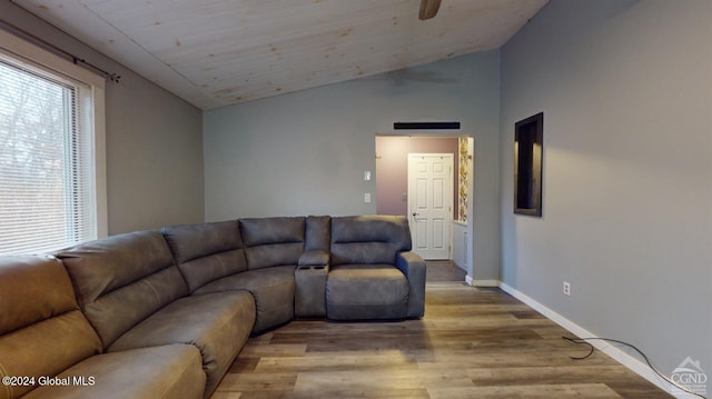 living room with light hardwood / wood-style flooring and lofted ceiling