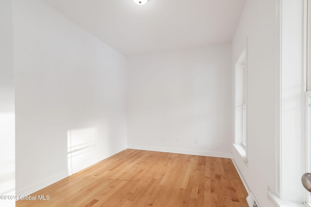 spare room featuring light hardwood / wood-style floors