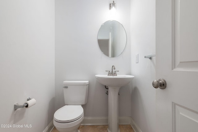 bathroom featuring toilet and tile patterned floors