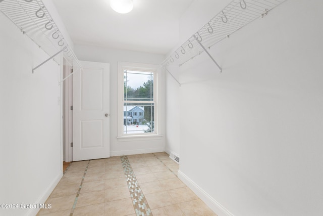 walk in closet featuring light tile patterned floors