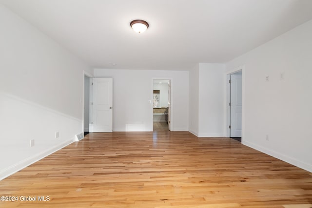 empty room with light hardwood / wood-style floors